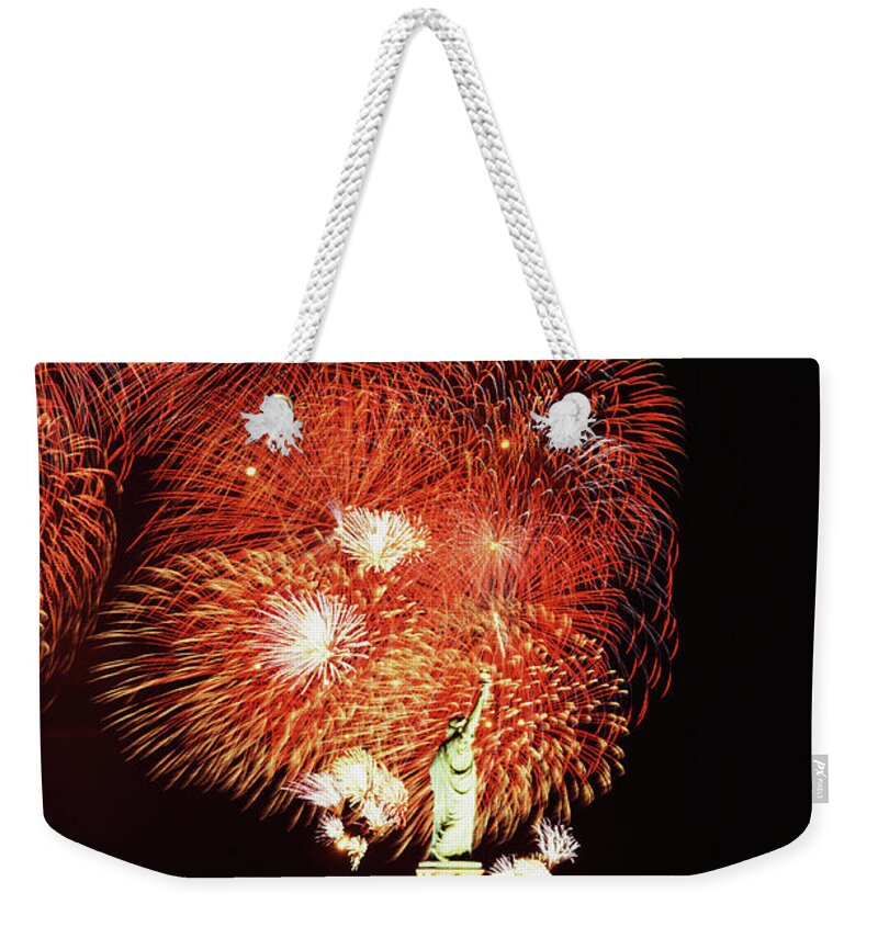 Firework Display Weekender Tote Bag featuring the photograph Statue Of Liberty With Fireworks by Jupiterimages