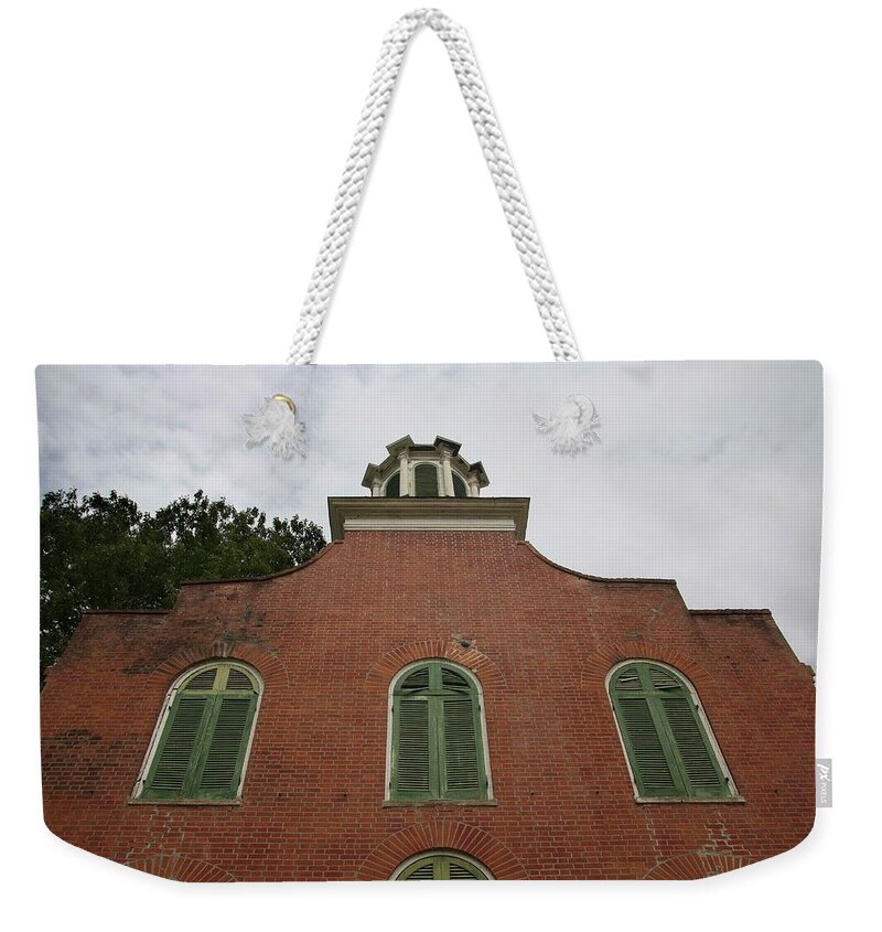 Historic Weekender Tote Bag featuring the photograph Still Standing Proud by Kelly Gomez
