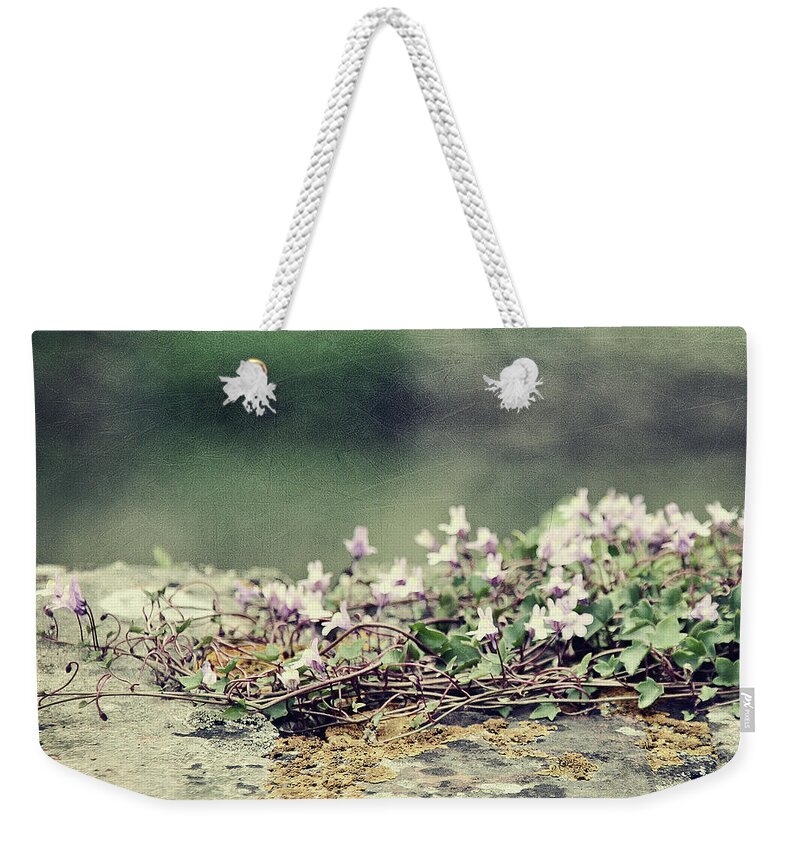 Stone Wall Weekender Tote Bag featuring the photograph Stone Wall With Flowers by Silvia Otten-nattkamp Photography