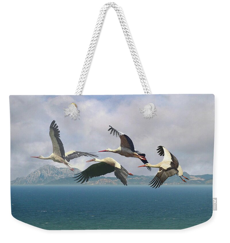 Birds Weekender Tote Bag featuring the digital art Storks Over the Straits of Gibraltar by M Spadecaller