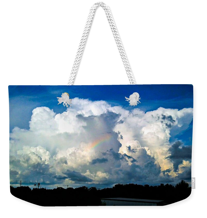 Sky Weekender Tote Bag featuring the photograph Storm and Rainbow by Ivars Vilums