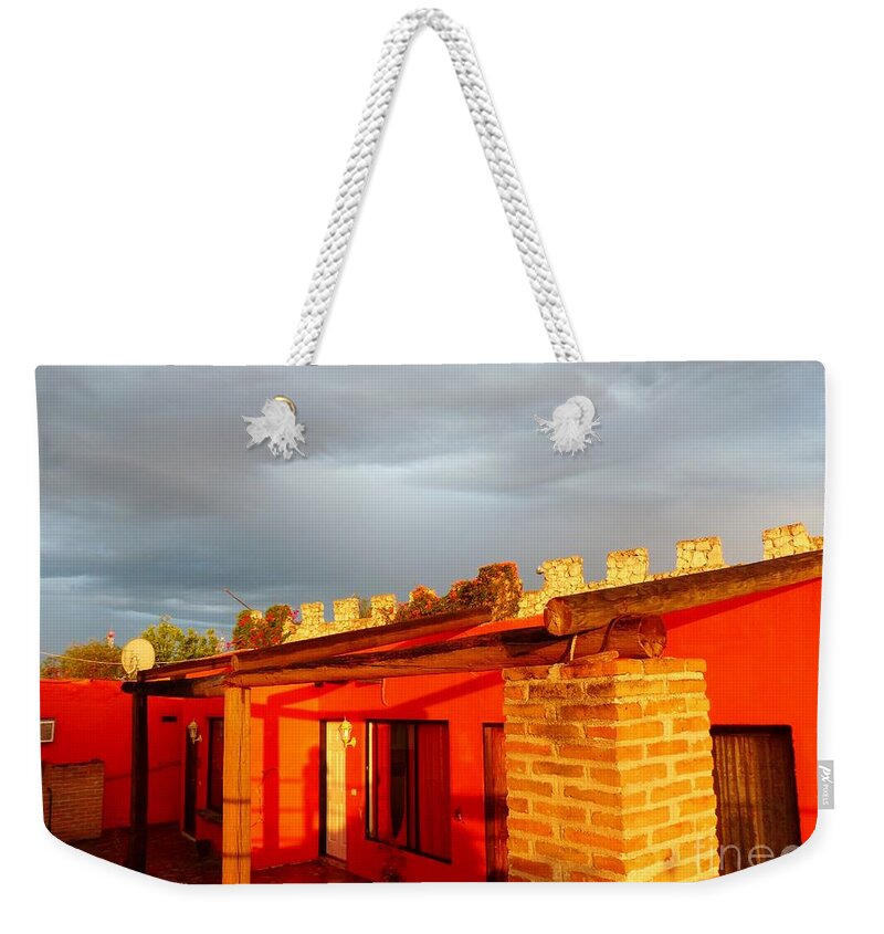 Red Building Reflecting Setting Sun Weekender Tote Bag featuring the photograph Sun Setting Storm Brewing by Rosanne Licciardi