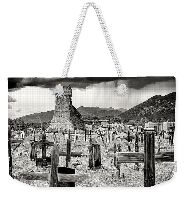Landscape Weekender Tote Bag featuring the photograph Storm Clouds Over Taos by Ron McGinnis