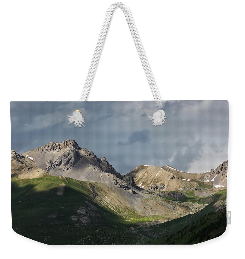 Mountain Landscape Weekender Tote Bag featuring the photograph Stormy evening over the Orennaye valley by Paul MAURICE