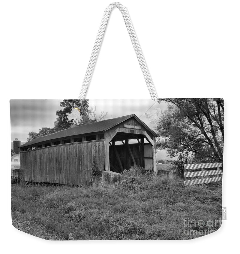 Kochenderfer Covered Bridge Weekender Tote Bag featuring the photograph Stormy Skies Over The Kochenderfer Covered Bridge Black And White by Adam Jewell