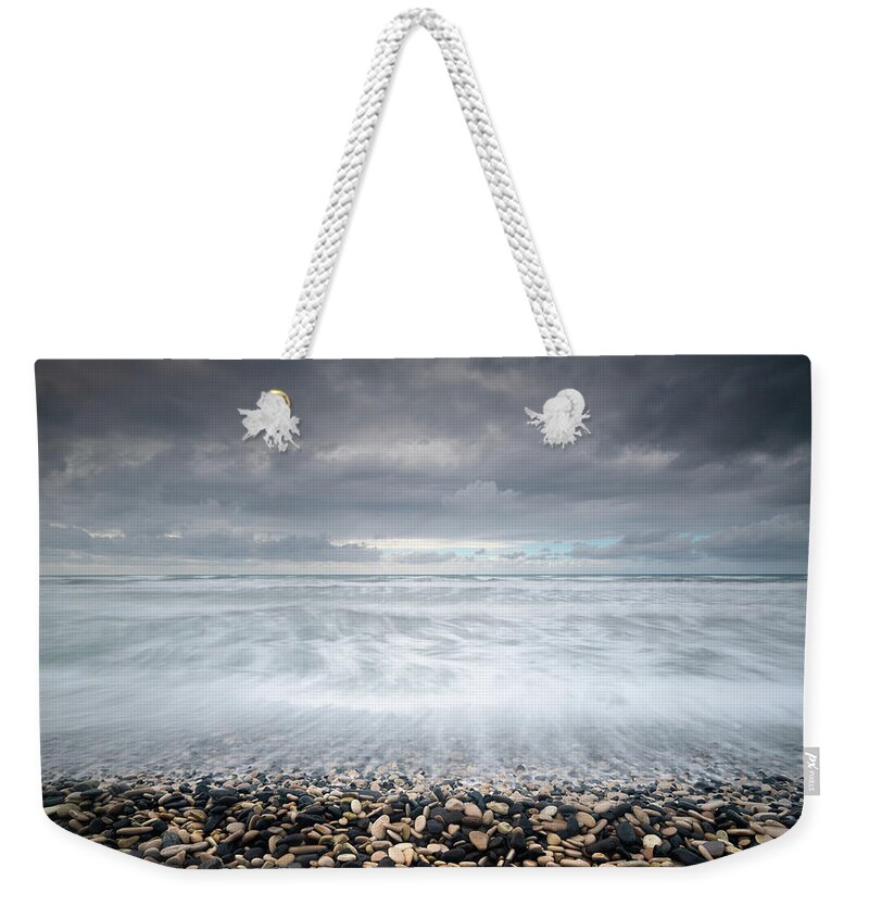 Coast Weekender Tote Bag featuring the photograph Stormy Sky and Wavy ocean by Michalakis Ppalis