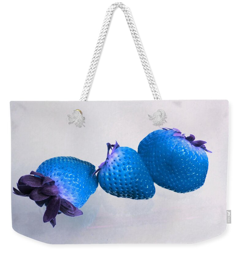 Blue Berries Weekender Tote Bag featuring the photograph straw Berry Blues by Tom Kelly