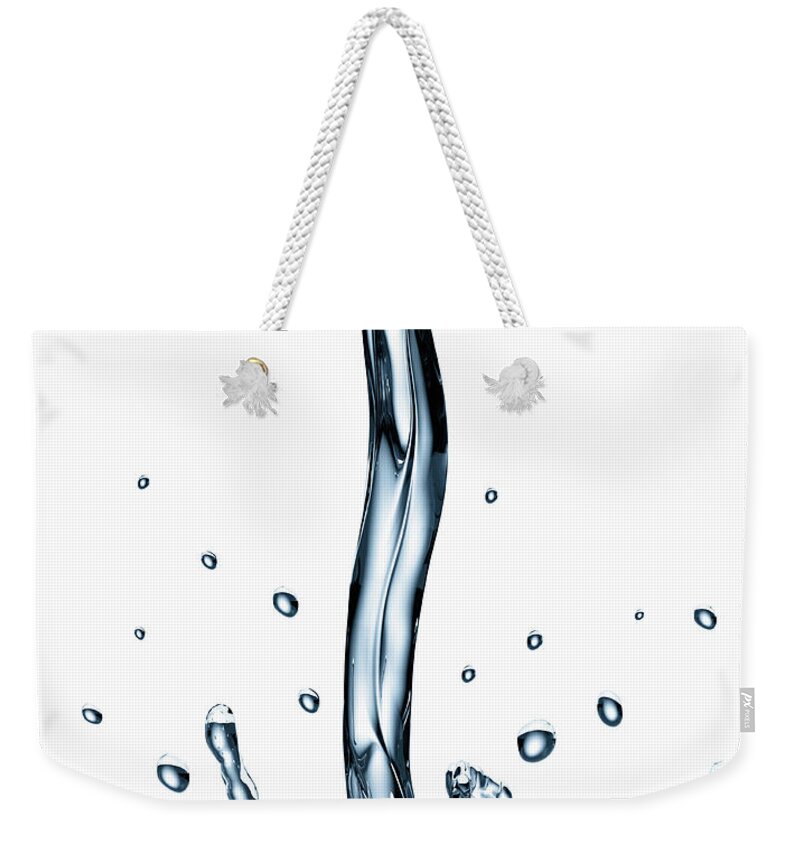 White Background Weekender Tote Bag featuring the photograph Stream Of Water Pouring And Splashing by Burazin
