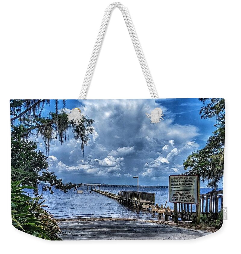 Clouds Weekender Tote Bag featuring the photograph Strolling by the Dock by Portia Olaughlin