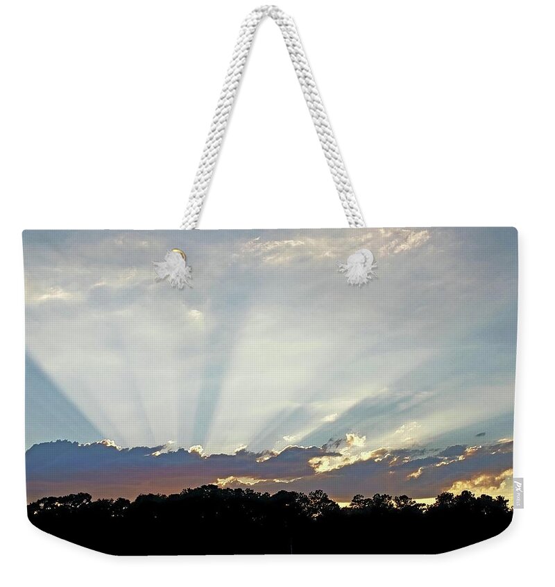 Sunset Weekender Tote Bag featuring the photograph Sun Ray Sunset by Karen Stansberry