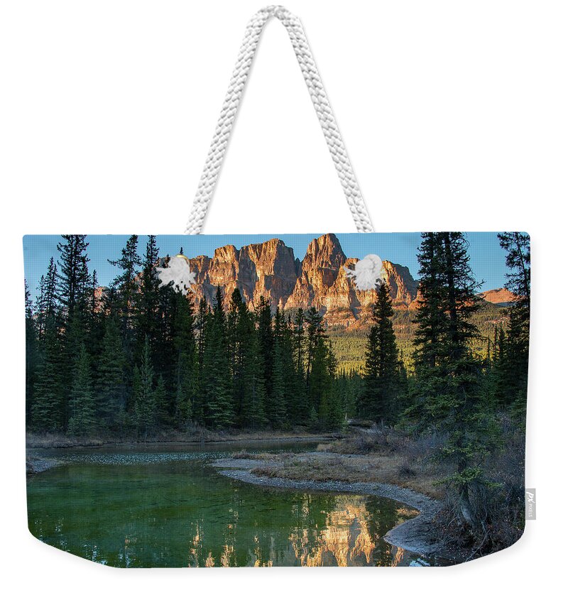2015 Weekender Tote Bag featuring the photograph Sun Setting on Castle Cliffs by Tim Kathka