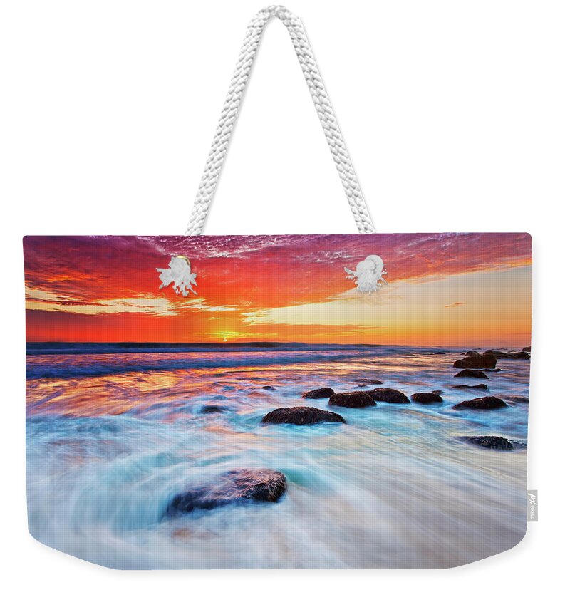 Scenics Weekender Tote Bag featuring the photograph Sun Setting Over The Atlantic Ocean At by Martin Harvey