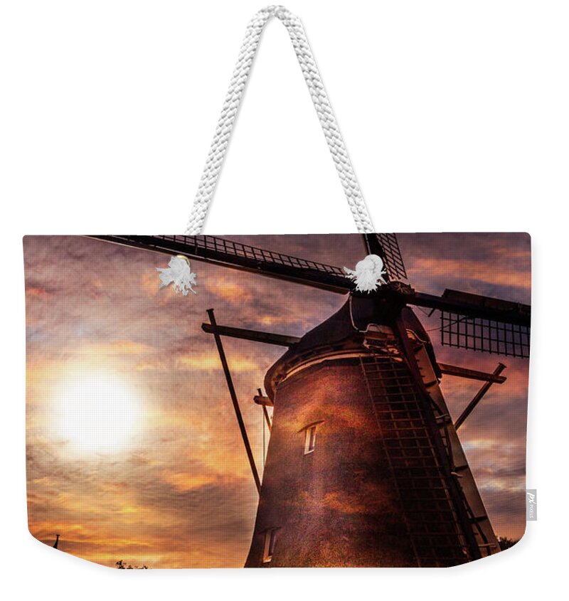 Clouds Weekender Tote Bag featuring the photograph Sundown over Holland by Debra and Dave Vanderlaan
