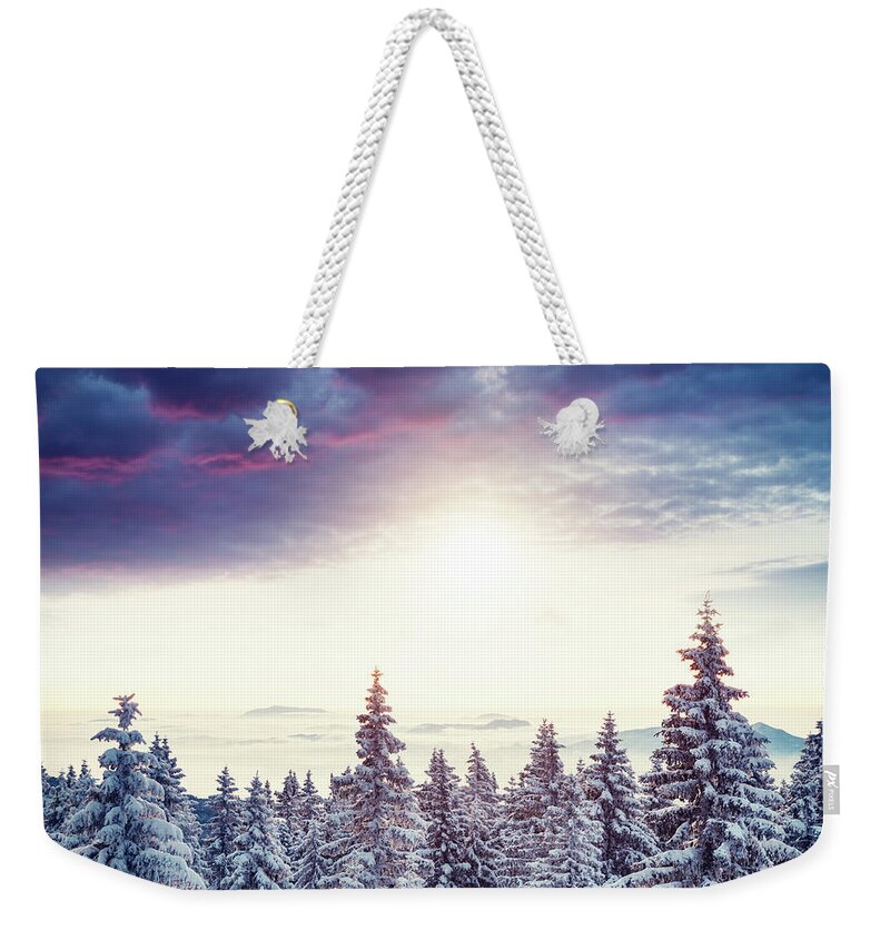 Scenics Weekender Tote Bag featuring the photograph Sunrise Above The Winter Forest by Borchee