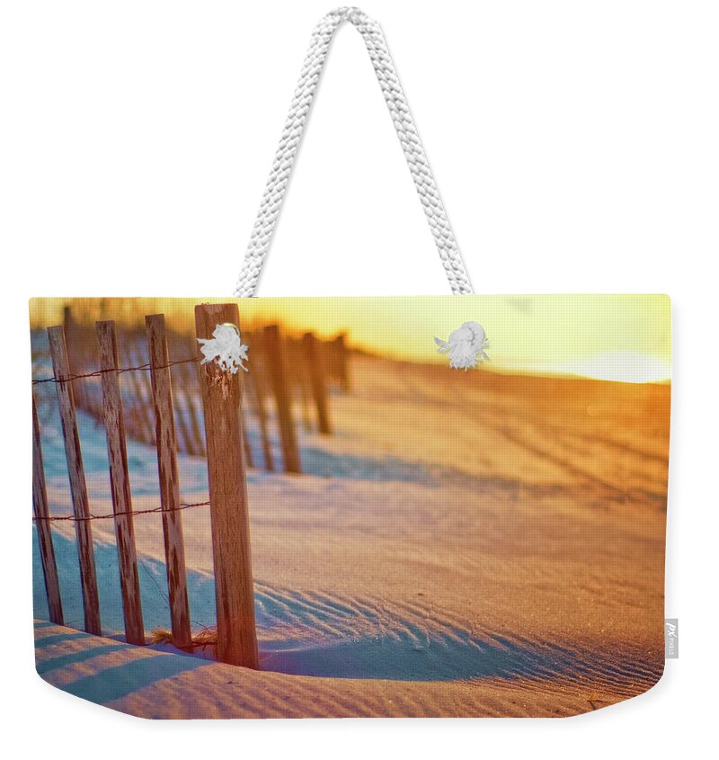 Tranquility Weekender Tote Bag featuring the photograph Sunrise Beach Fence With Carved Heart by Trina Dopp Photography