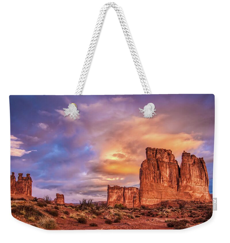 Arches National Park Weekender Tote Bag featuring the photograph Sunrise on The Organ, Tower of Babel and the Three Gossips by Brenda Jacobs