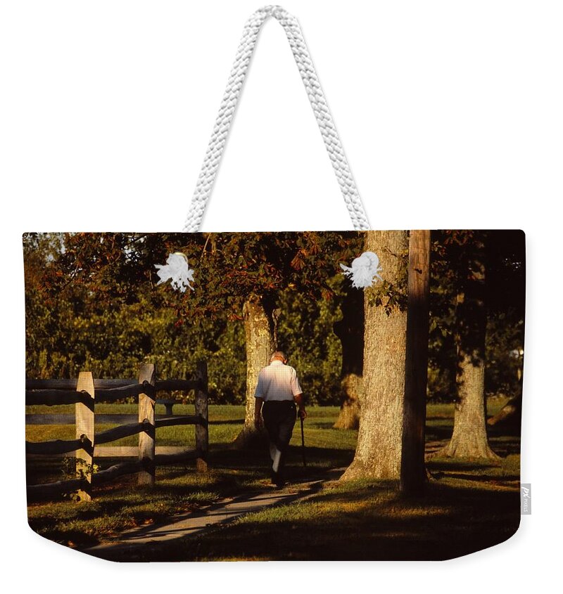 Old Man Weekender Tote Bag featuring the photograph Sunrise Walk by Marty Klar