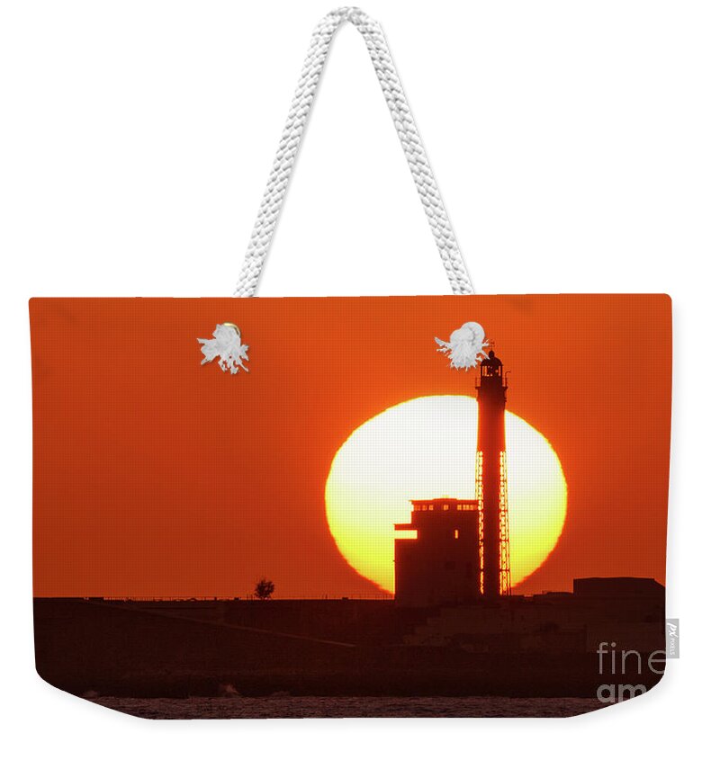 Island Weekender Tote Bag featuring the photograph Sunset at Saint Sebastian Lighthouse by Pablo Avanzini