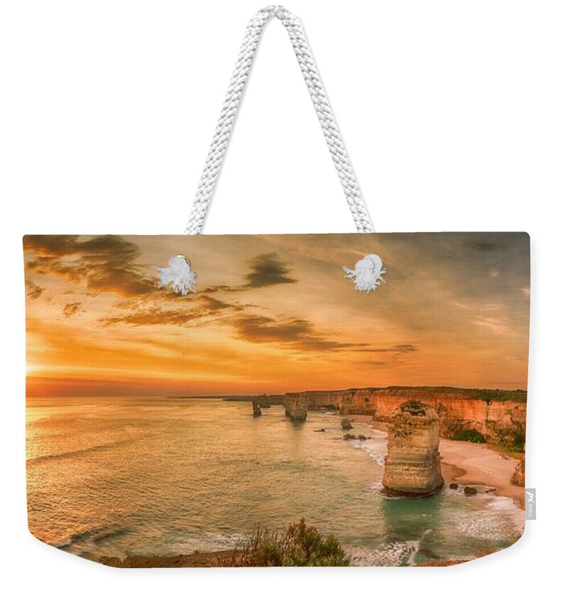 12apostles Weekender Tote Bag featuring the photograph Sunset at The Twelve Apostles by Chris Cousins