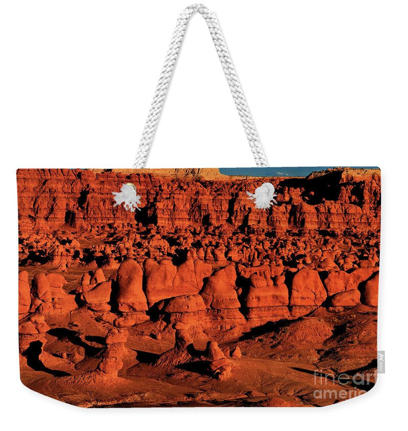 North America Weekender Tote Bag featuring the photograph Sunset Light Turns The Hoodoos Blood Red In Goblin Valley State Park Utah by Dave Welling