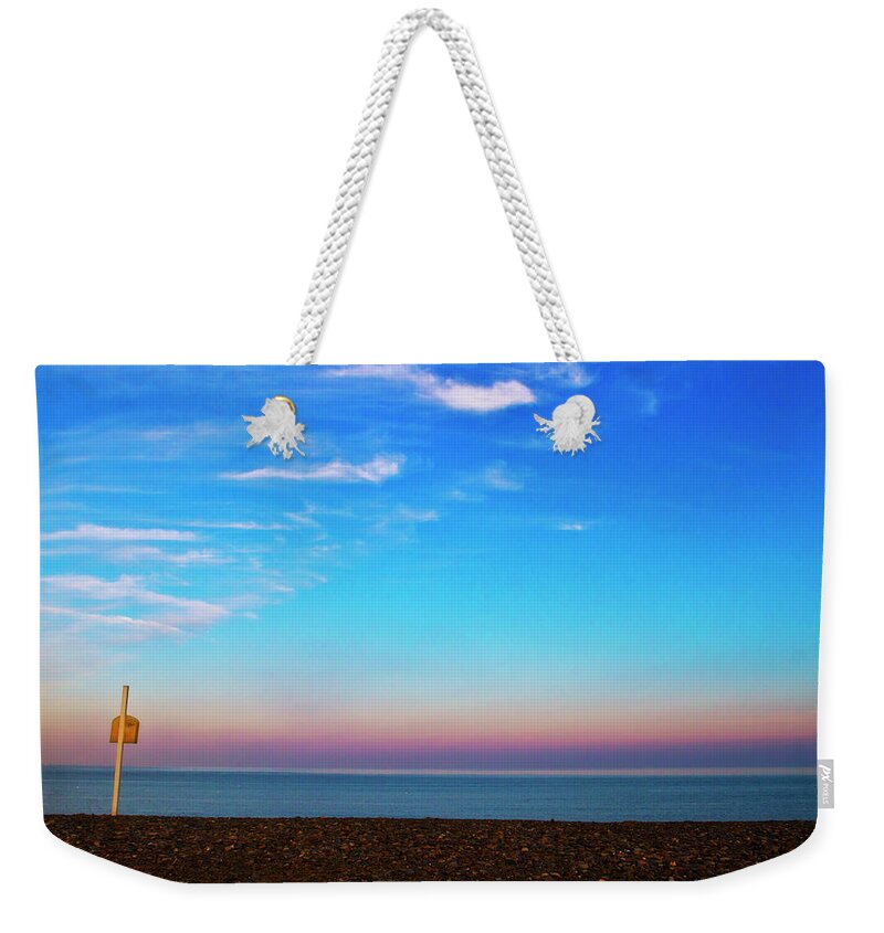 Scenics Weekender Tote Bag featuring the photograph Sunset On Empty Beach With Lifebouy On by Image By Catherine Macbride