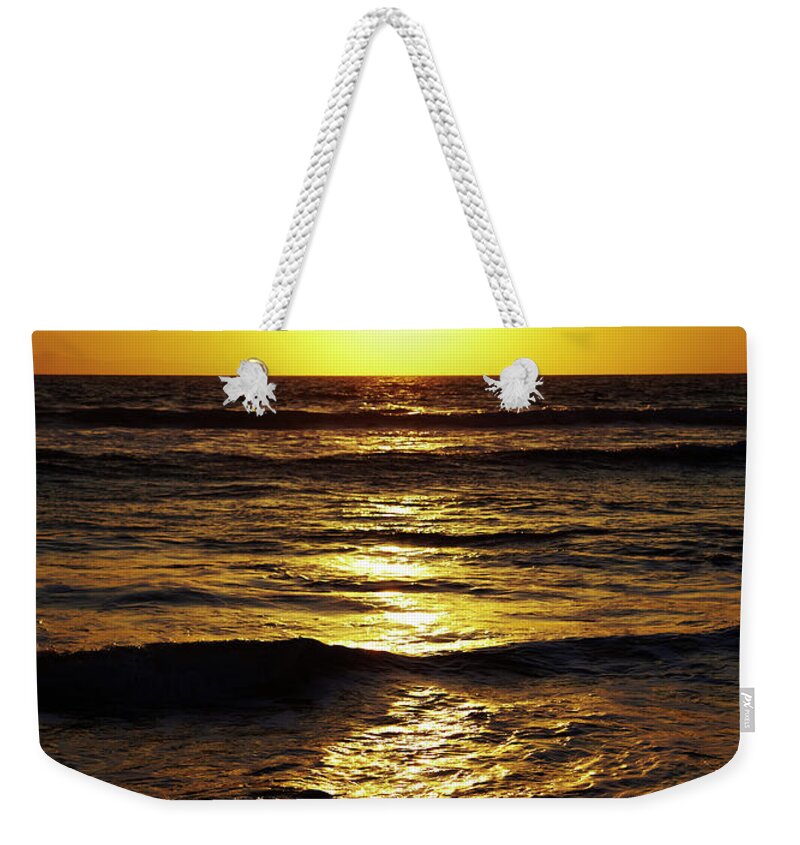 Tranquility Weekender Tote Bag featuring the photograph Sunset Over The Pacific Ocean by Thomas Northcut