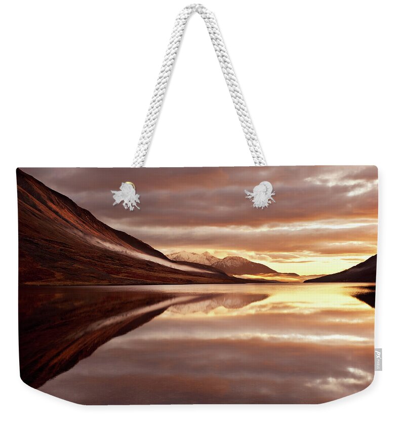 Tranquility Weekender Tote Bag featuring the photograph Sunset With Firely Sky Reflected By Loch by Chee Seong