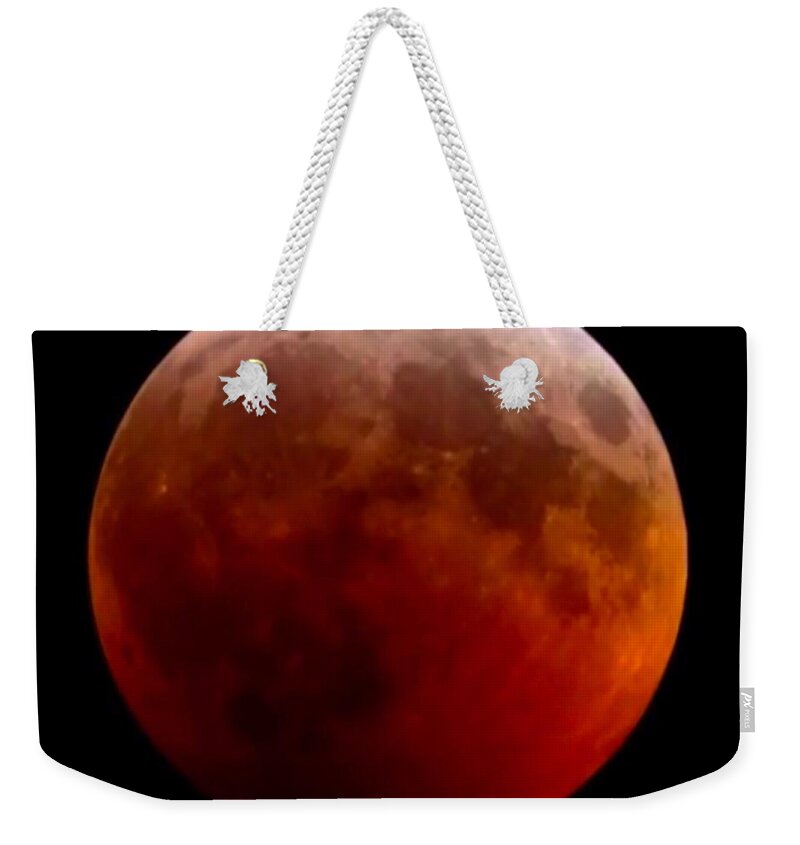 Lunar Eclipse Weekender Tote Bag featuring the photograph Super Blood Wolf Moon by Chris Montcalmo