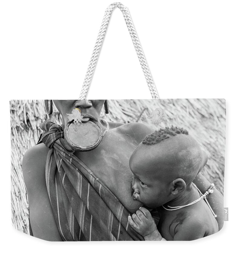 Portrait Weekender Tote Bag featuring the photograph Mursi Mother and child by Mache Del Campo