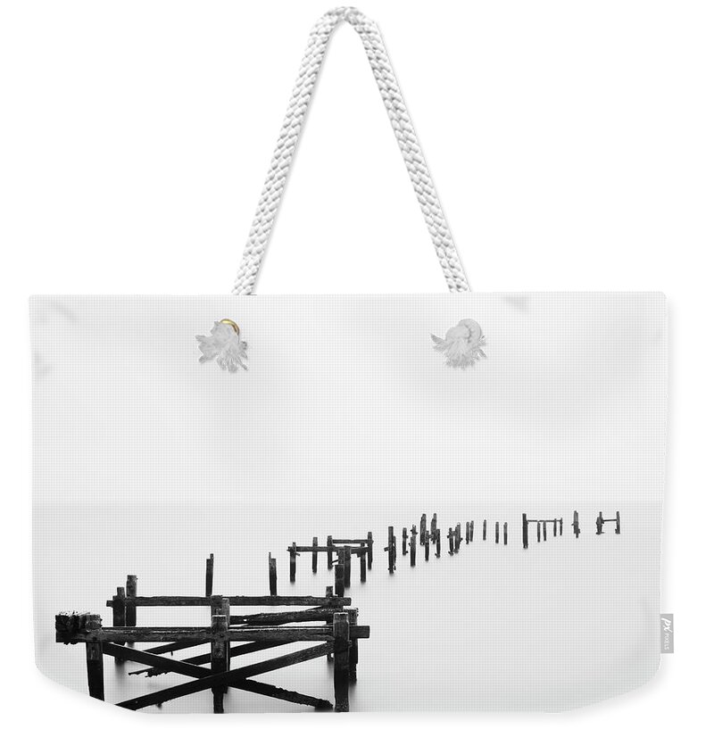 Tranquility Weekender Tote Bag featuring the photograph Swanage Pier by Doug Chinnery