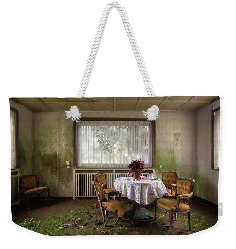 Urban Weekender Tote Bag featuring the photograph Table in Abandoned Dining Room by Roman Robroek