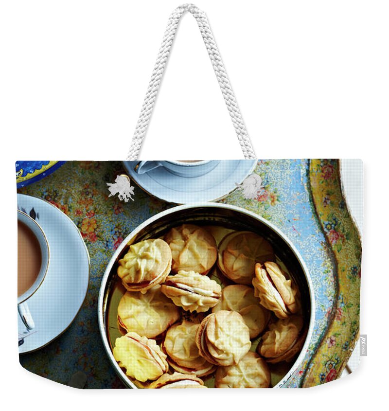 Refreshment Weekender Tote Bag featuring the photograph Tea And Home Made Biscuits On Tray by Martin Poole