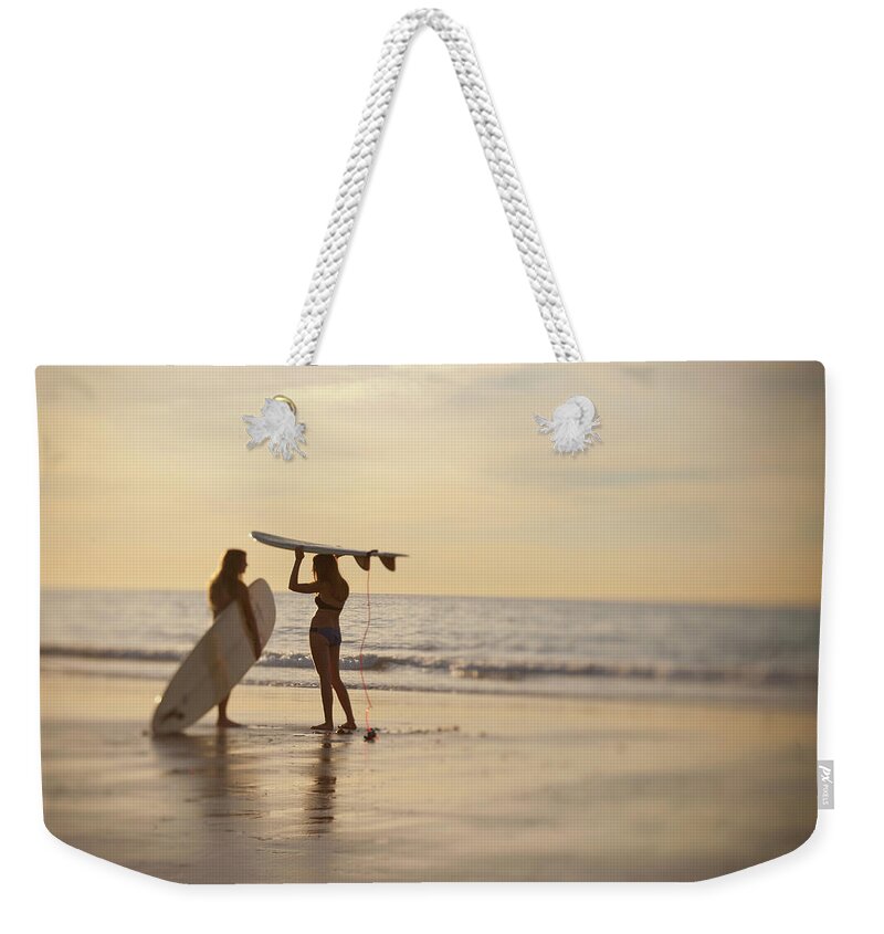 Adolescence Weekender Tote Bag featuring the photograph Teen Girls With Surfboards Discussing by Stephen Simpson