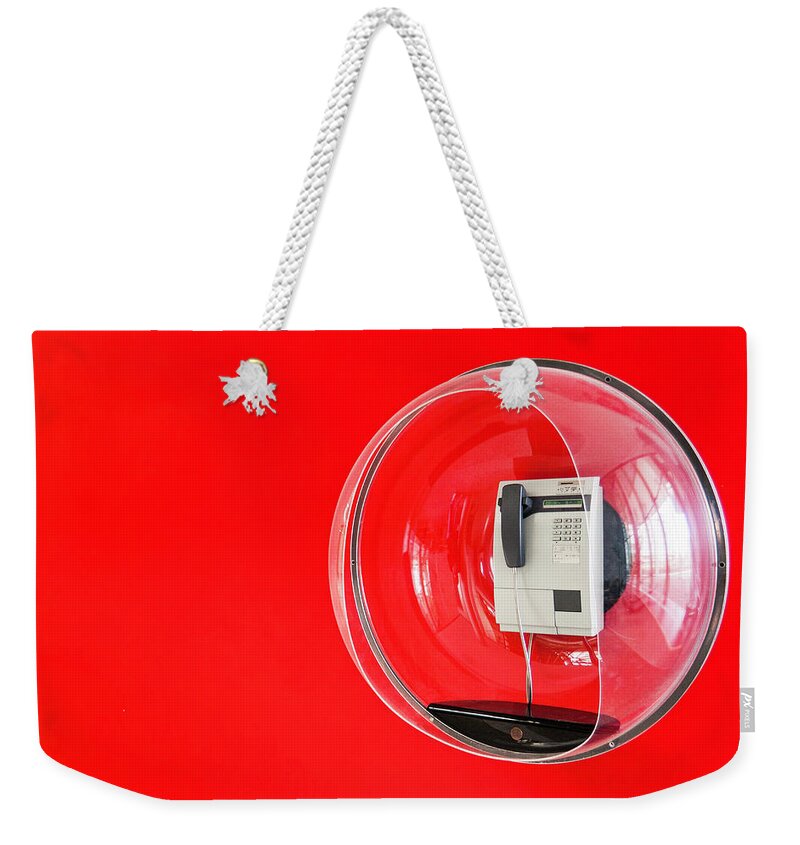 Pay Phone Weekender Tote Bag featuring the photograph Telephone In Decorative Plastic Bubble by Manuel Sulzer