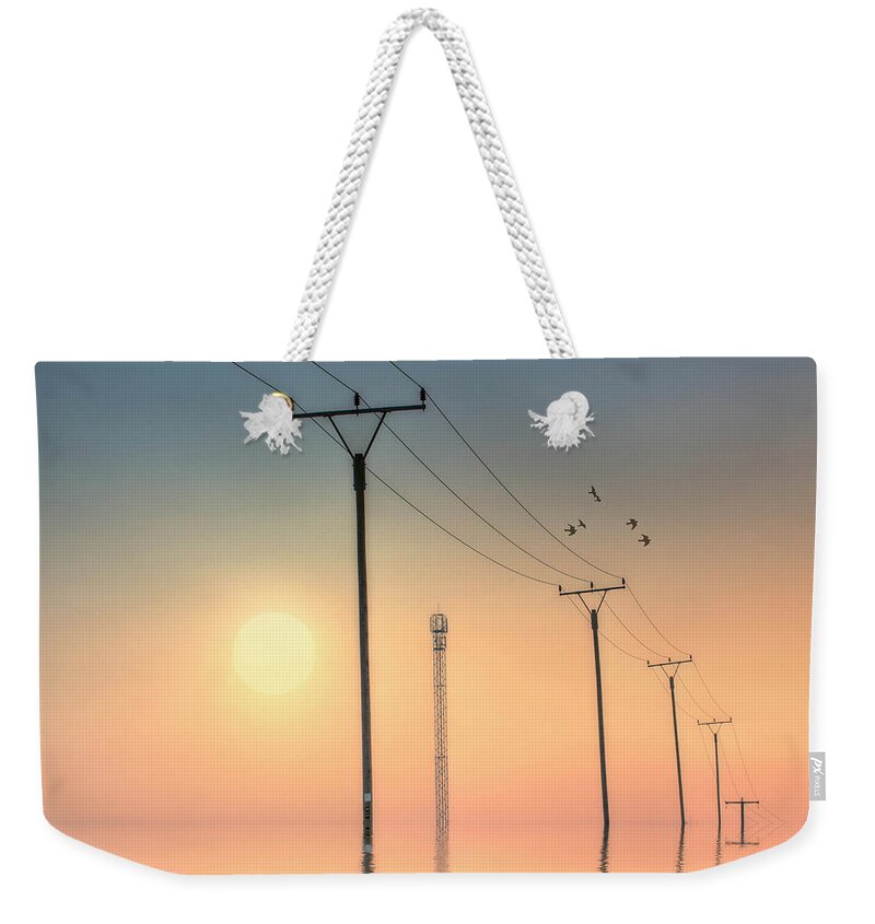 In A Row Weekender Tote Bag featuring the photograph Telephone Post At Sunset by Kurtmartin