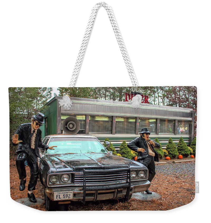The Blue Brothers Weekender Tote Bag featuring the photograph The Blues Brothers At A Diner by Kristia Adams