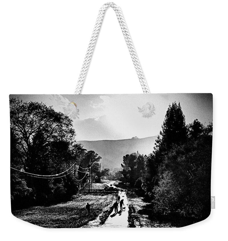 Black And White Weekender Tote Bag featuring the photograph The Dog Walkers by Brad Hodges