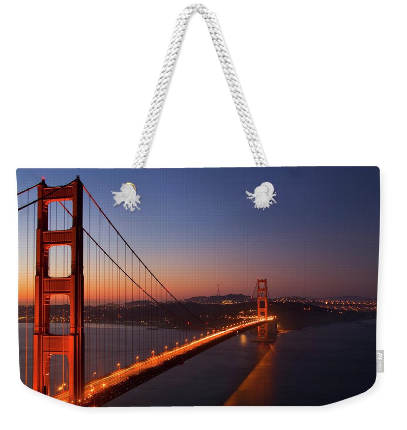 San Francisco Weekender Tote Bag featuring the photograph The Golden Gate Bridge At Dawn by Worldofphotos