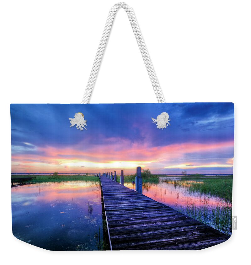 Clouds Weekender Tote Bag featuring the photograph The Long Dock by Debra and Dave Vanderlaan