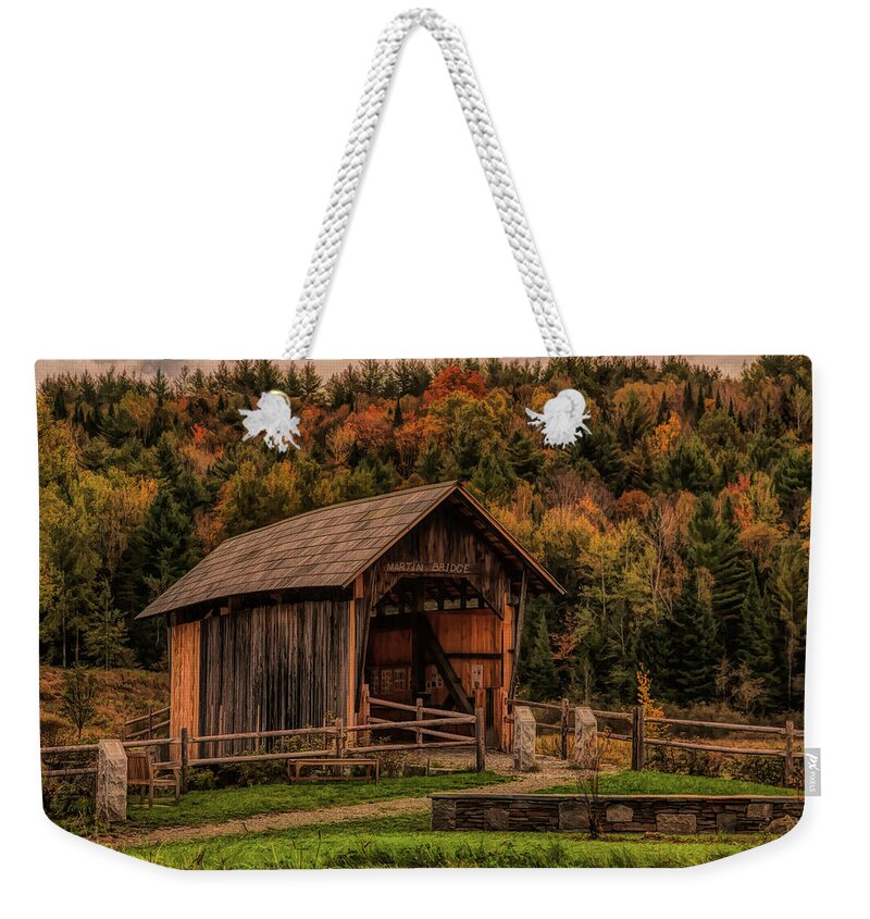 Autumn Foliage New England Weekender Tote Bag featuring the photograph The Martin covered bridge in Marshfield VT. by Jeff Folger