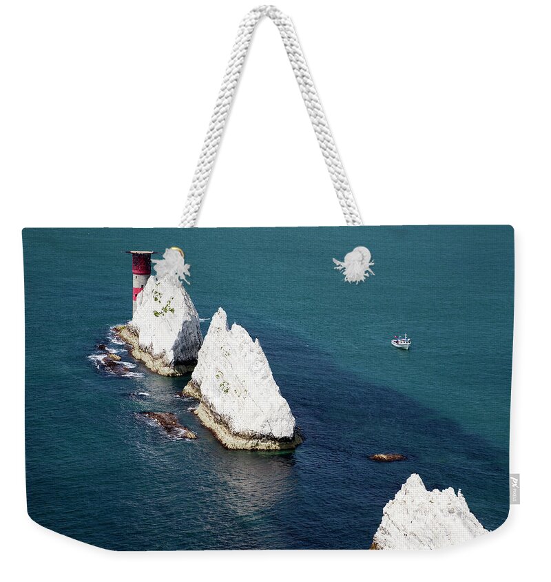 Needles Lighthouse Weekender Tote Bag featuring the photograph The Needles, Isle Of Wight by Markgoddard