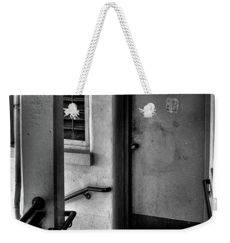 The Newspaper Weekender Tote Bag featuring the photograph The Newspaper by David Patterson