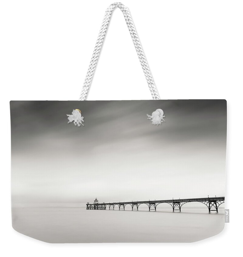 Pier Weekender Tote Bag featuring the photograph The old Pier by Dominique Dubied