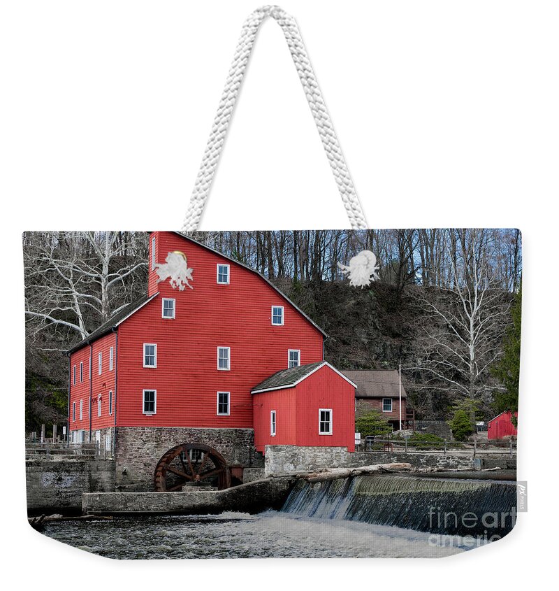 Red Mill Weekender Tote Bag featuring the photograph The red mill historical landmark. by Sam Rino