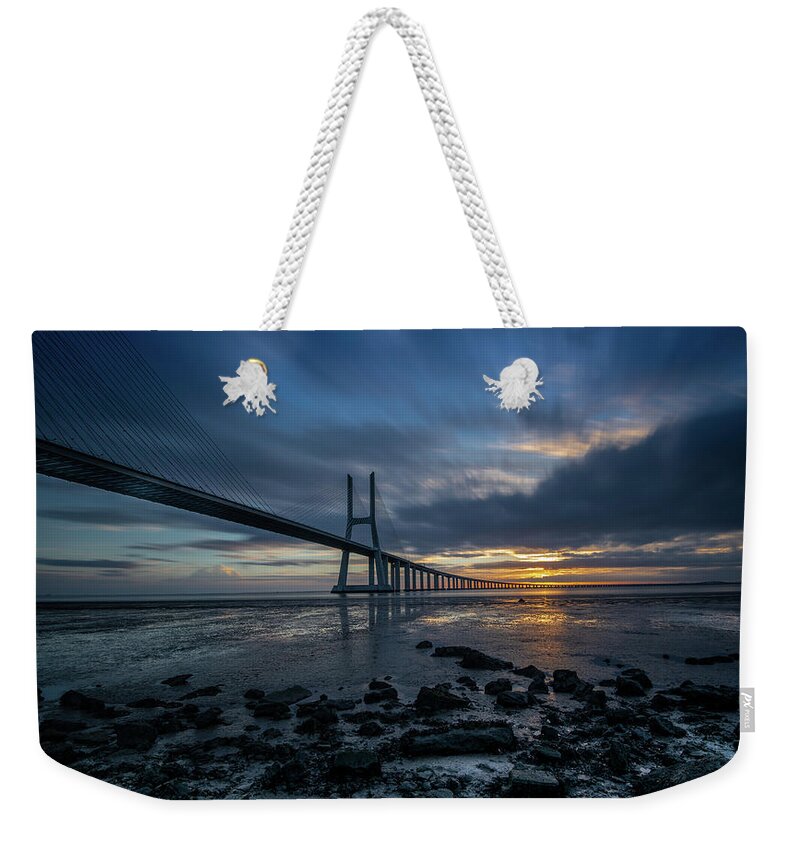 Bridge Weekender Tote Bag featuring the photograph The Vasco Da Cama Bridge in Lisbon Portugal by Michalakis Ppalis