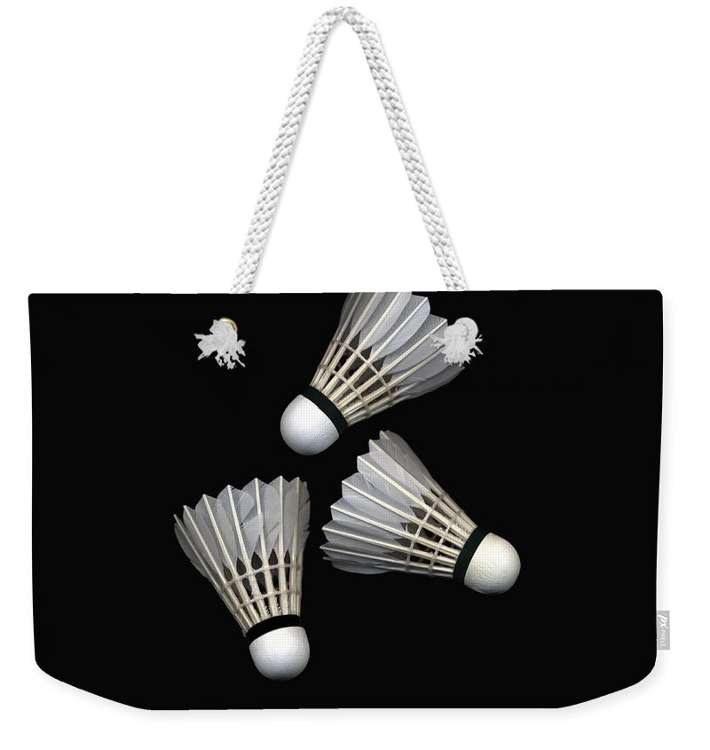 Black Background Weekender Tote Bag featuring the photograph Three Shuttlecocks On Black Background by Siri Stafford