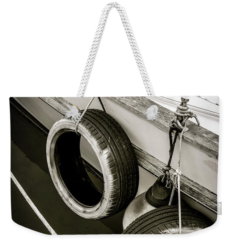 Boat Weekender Tote Bag featuring the photograph Tire Swing Sailing by Becqi Sherman
