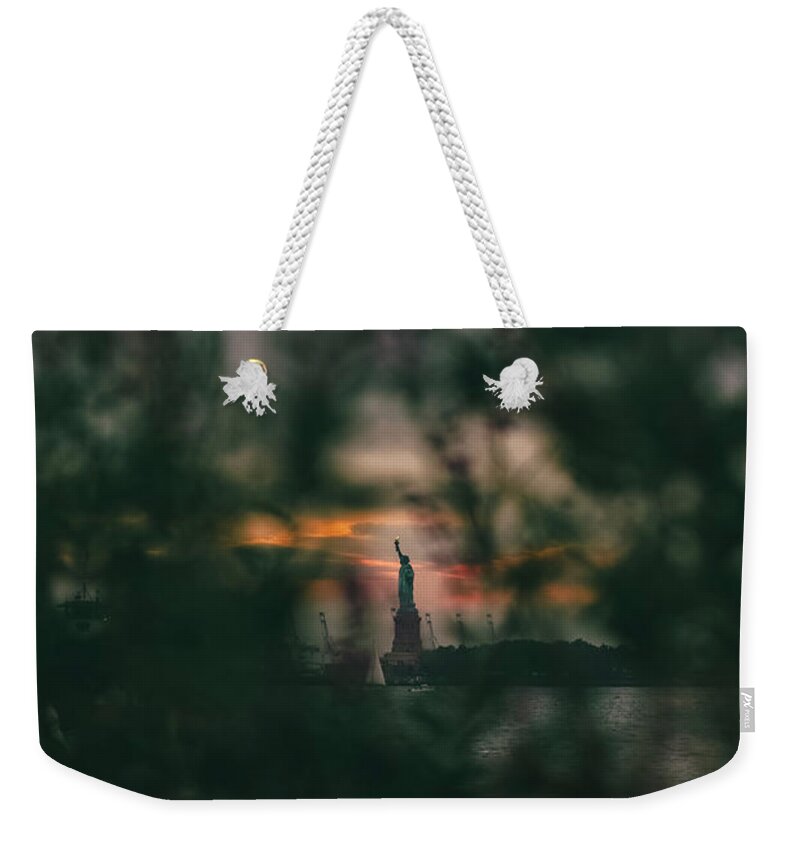 Statue Weekender Tote Bag featuring the photograph Torchlight by Peter Hull