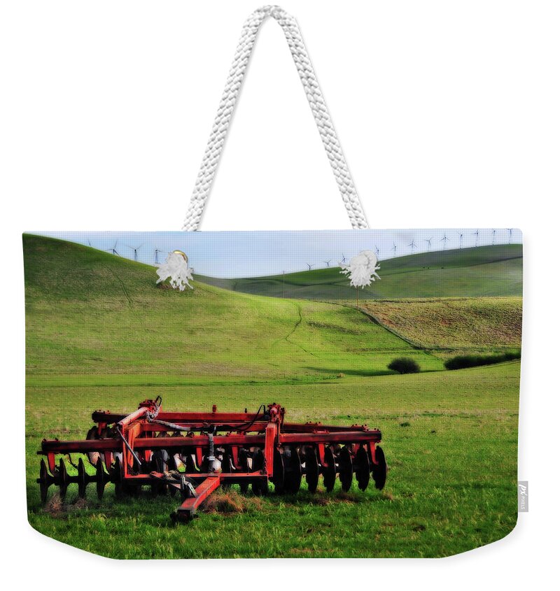 Working Weekender Tote Bag featuring the photograph Tractor Blades On Green Pasture by Mitch Diamond