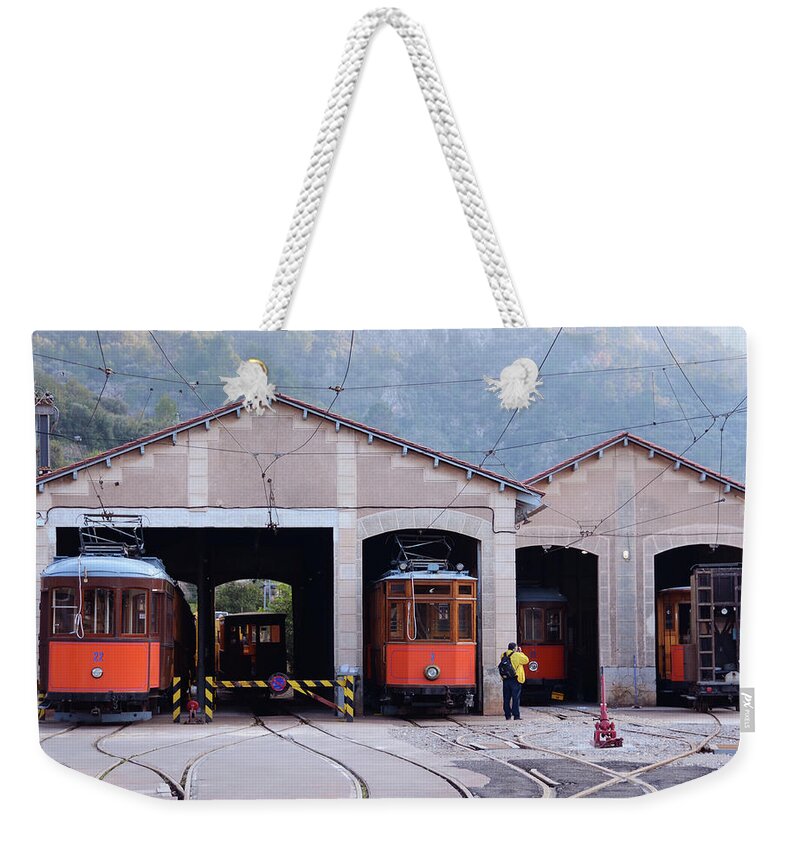 People Weekender Tote Bag featuring the photograph Train Sheds, Soller by Carolyn Eaton
